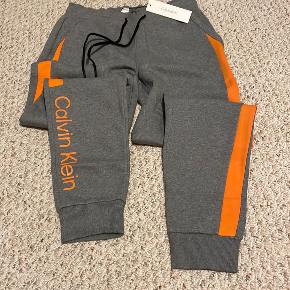 Calvin Klein gray and orange sweatpants brand new size small